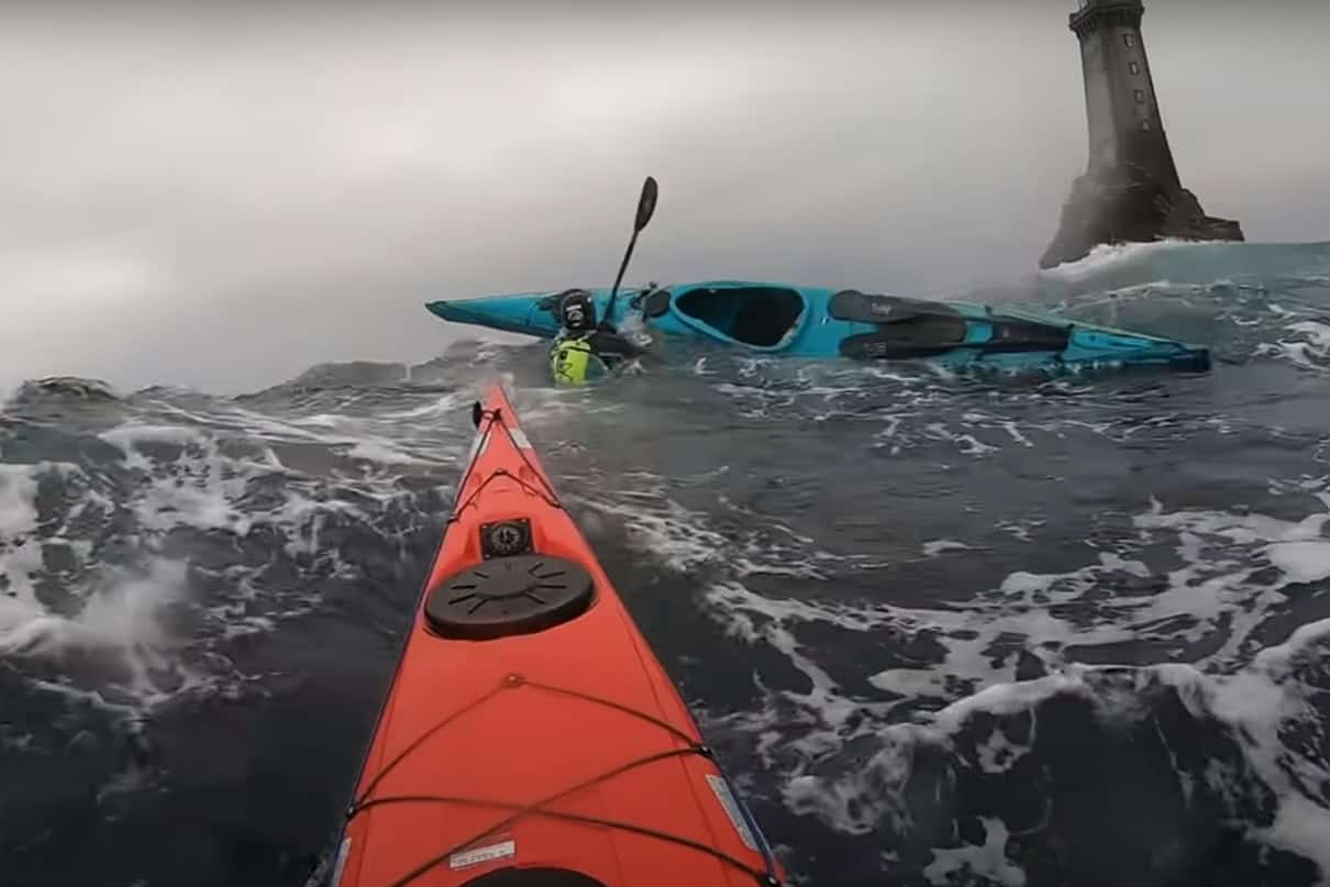 image of a capsize in a sea kayak in rough water.