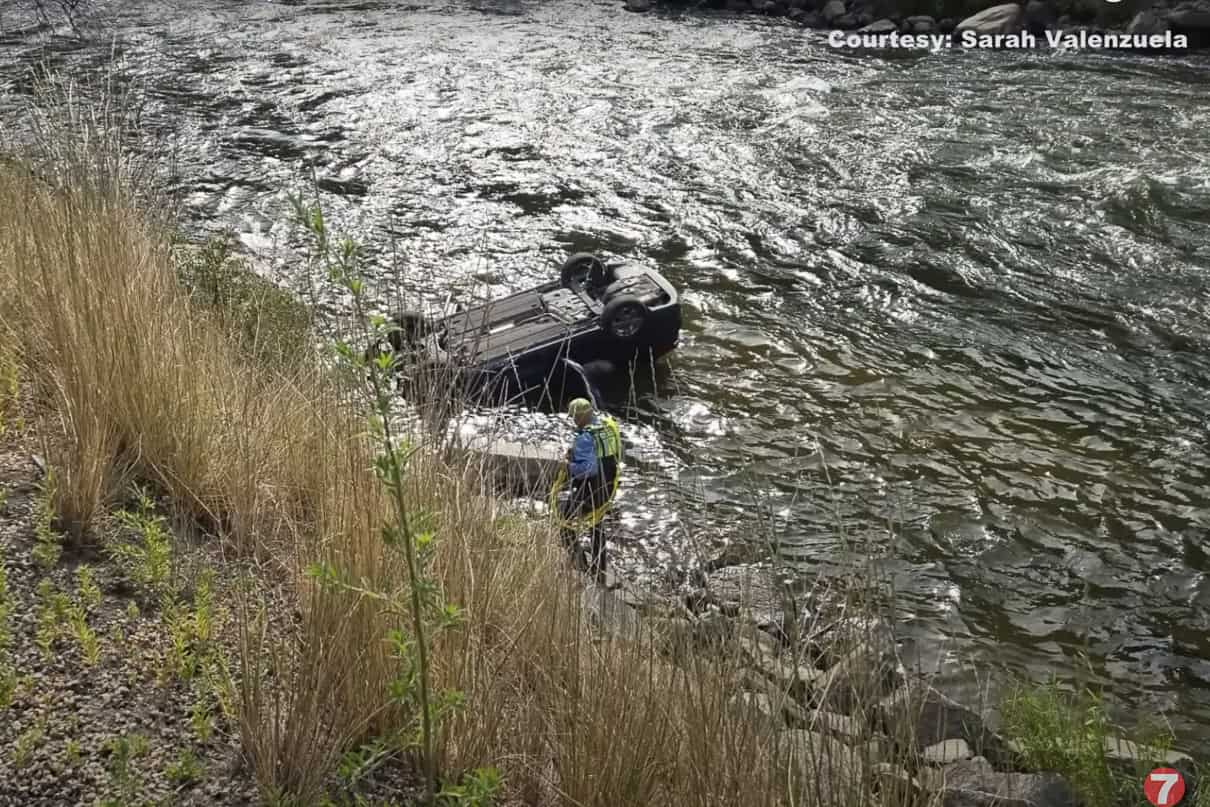 The overturned car in the Payette River. 