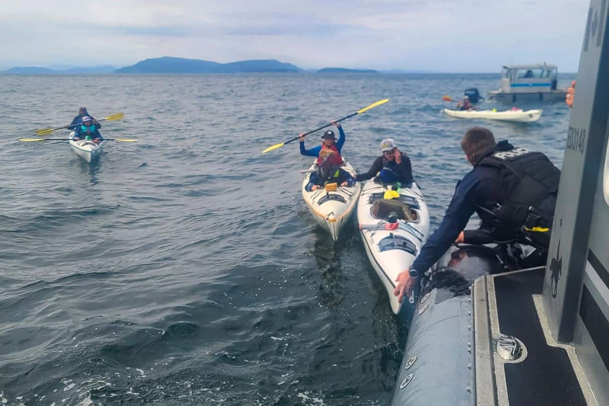 Kayakers are rescued in the San Juan Islands. Feature Image: USCG Petty Officer 1st Class Steven Strohmaier