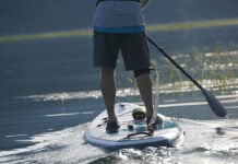 man paddles his paddleboard