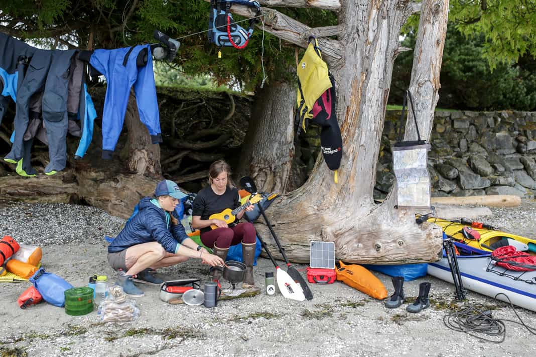 women surrounding by paddling gear