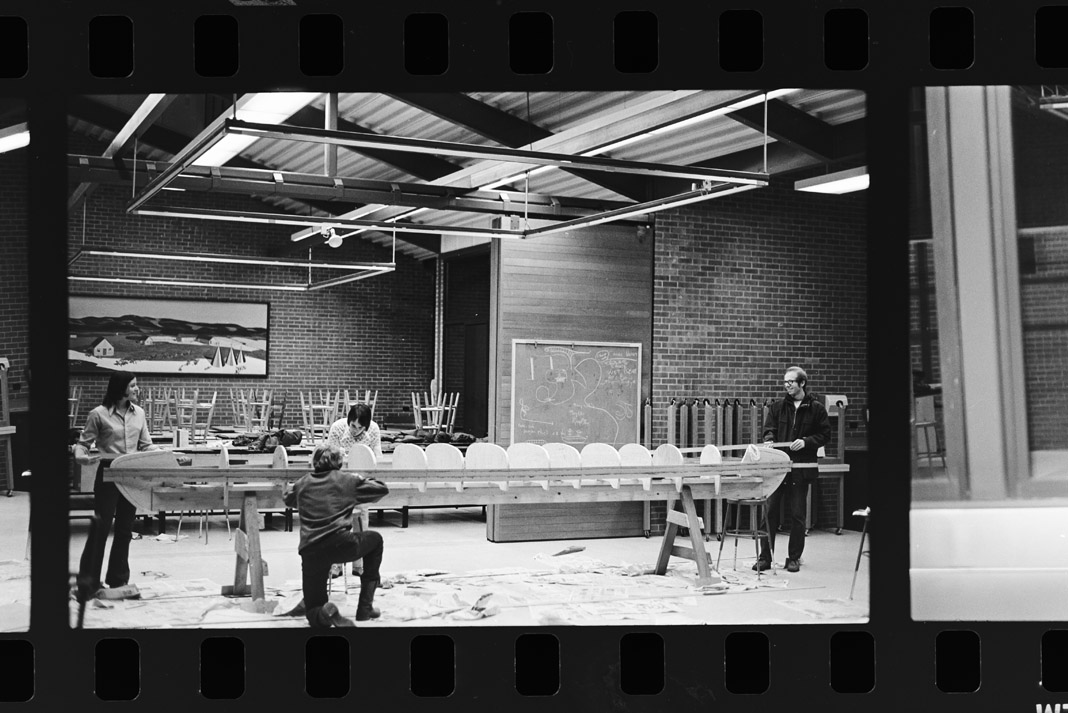 people building canoes