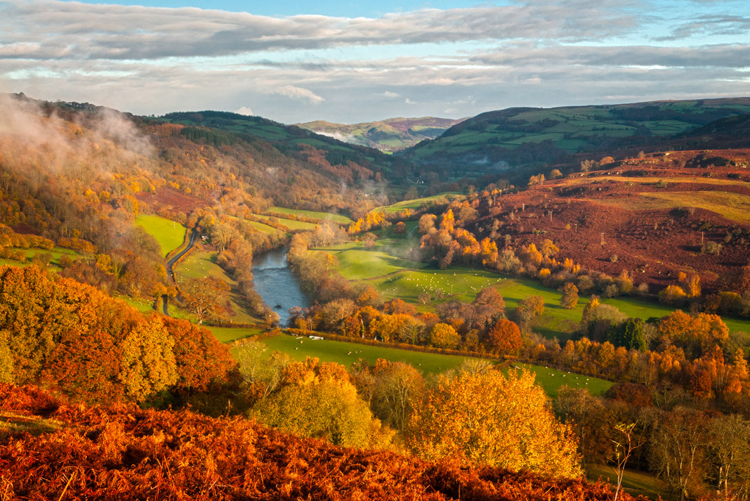 Scenic view of rolling mountains and fields surrounding the River Wye